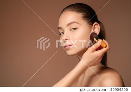 Beautiful female eyes with make-up and brush Beautiful female eyes with make-up and brush 30904296