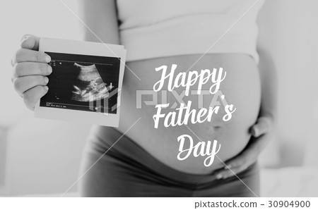 Pregnant woman holding ultrasound photo. Fathers Pregnant woman holding ultrasound photo. Fathers 30904900