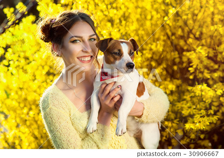Beautiful woman playing with her dog. Outdoor Beautiful woman playing with her dog. Outdoor 30906667