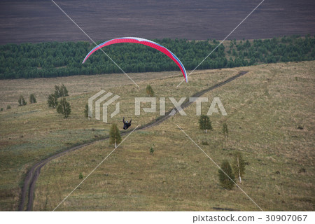 Paragliding in mountains 30907067