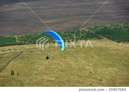 Paragliding in mountains 30907069