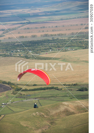 Paragliding in mountains Paragliding in mountains 30907089