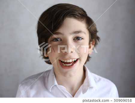 preteen boy laughing smiling portrait 30909058