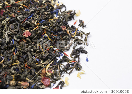 Closeup of heap of dry green tea leaves. 30910068