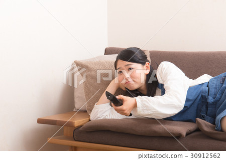 A Housewife Lying Down On The Sofa Stock Photo 30912562 Pixta