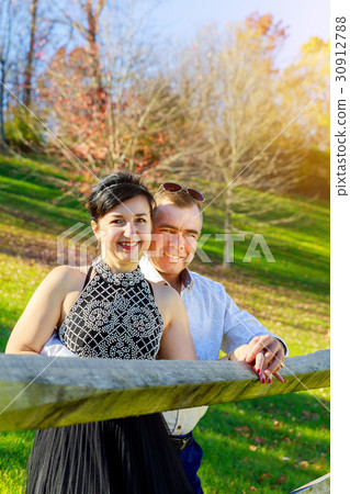 Beautiful couple girl and man walking in the park Beautiful couple girl and man walking in the park 30912788