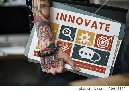Tattooed hand with different icons on a clipboard 30915111