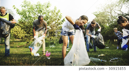 Diverse Group of People Picking Up Trash in The Park Volunteer Community Service Diverse Group of People Picking Up Trash in The Park Volunteer Community Service 30915855