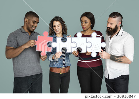People are holding puzzle together 30916847