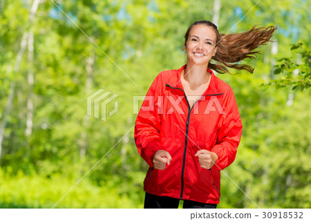 healthy young female athlete running healthy young female athlete running 30918532