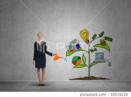 Young businesswoman in empty room watering drawn growth concept with can 30919226