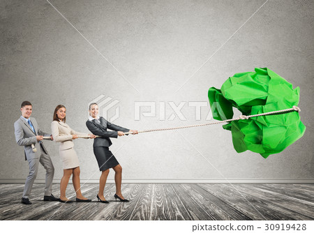 Young business people and huge paper ball as symbol of creativity Young business people and huge paper ball as symbol of creativity 30919428