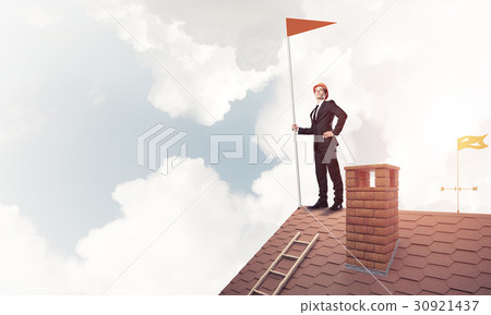 Young businessman with flag presenting concept of leadership. Mi 30921437