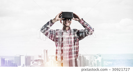 Guy wearing checked shirt and virtual mask demonstrating some emotions Guy wearing checked shirt and virtual mask demonstrating some emotions 30921727