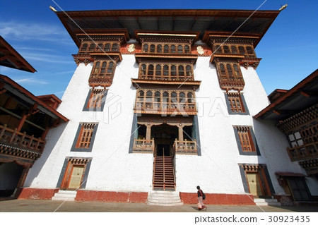 Woman in traditional Bhutanese dress in Paro Dzong 30923435