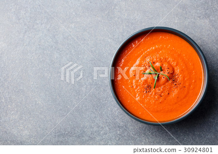 Tomato soup in a black bowl. Top view. Copy space Tomato soup in a black bowl. Top view. Copy space 30924801