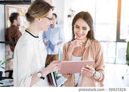 Hilarious smiling interested girls in office 30925826