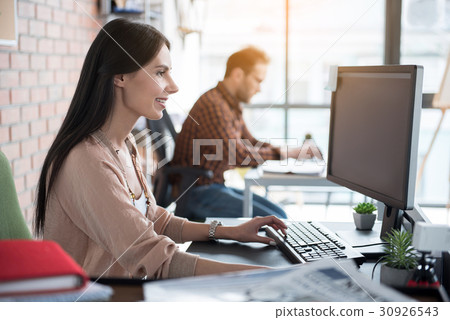 Happy smiling woman at work 30926543