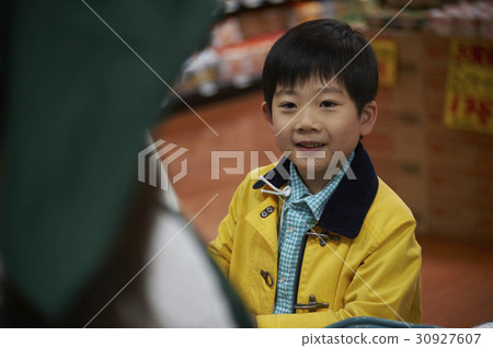 A boy making an impatient payment 30927607