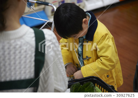 A boy making an impatient payment 30927625