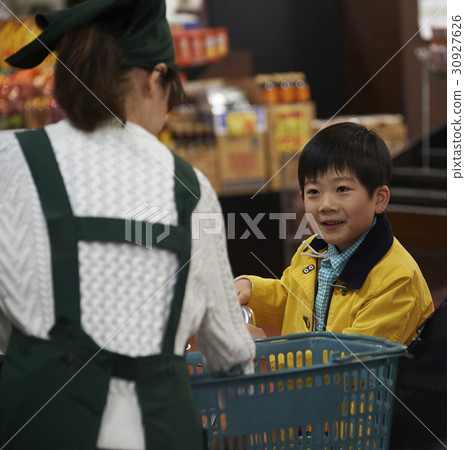 A boy making an impatient payment 30927626