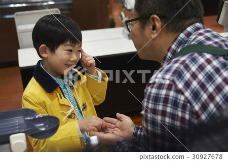 Boy and male clerk paying tiresome fees 30927678
