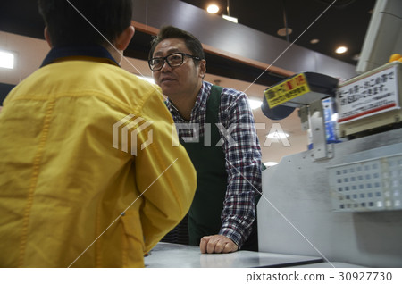 Boy and male clerk paying tiresome fees Boy and male clerk paying tiresome fees 30927730