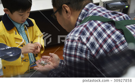 A boy making an impatient payment 30927858