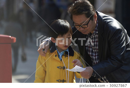 A boy listening to an obsession 30927867