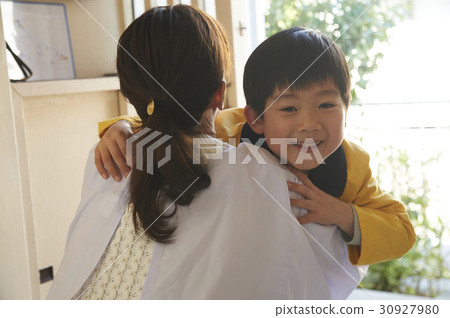 Mother who hugs a boy who came home crazy Mother who hugs a boy who came home crazy 30927980