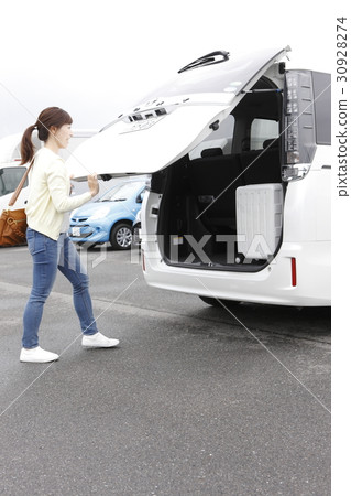 A woman carrying loads 30928274