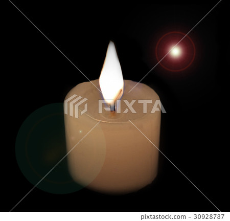 White candles on a black background. White candles on a black background. 30928787