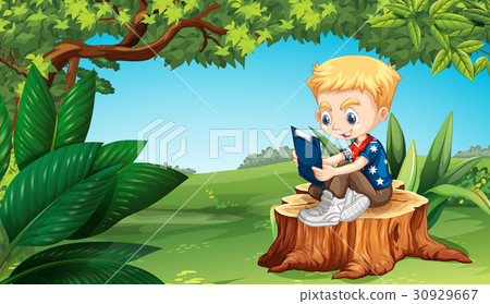 Boy reading in the park Boy reading in the park 30929667