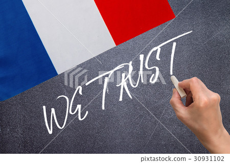 WE TRUST on the chalk board and the flag of France 30931102