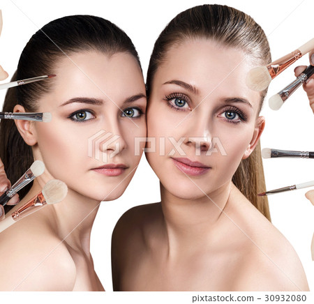 Two young women and makeup brushes. Two young women and makeup brushes. 30932080