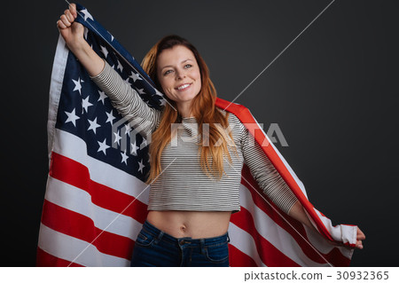 Sincere inspiring woman feeling patriotic 30932365