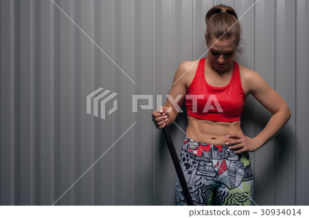 Portrait of sporty fit girl looking down 30934014