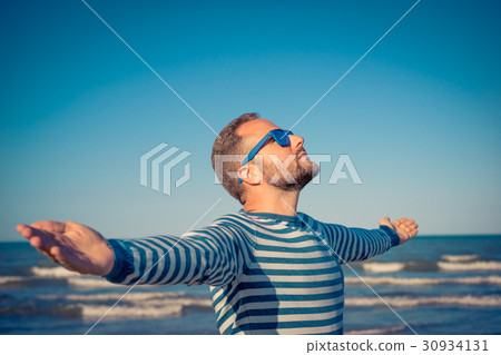Happy man on summer vacation Happy man on summer vacation 30934131