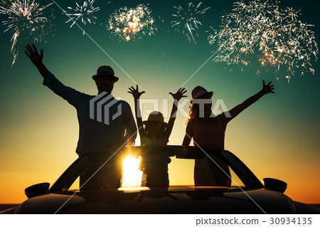 Silhouette of happy family at the beach 30934135