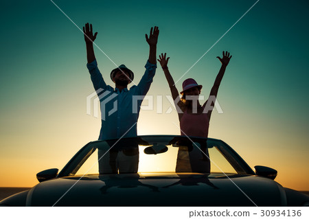Silhouette of happy couple at the beach Silhouette of happy couple at the beach 30934136