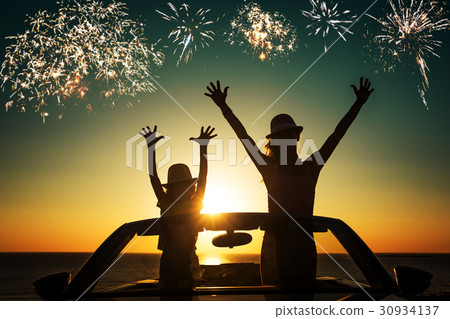 Silhouette of happy family at the beach 30934137