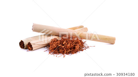 Tobacco pile and cigarette on white background 30934180