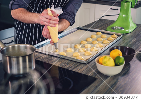 Chef cook working on a modern kitchen at home Chef cook working on a modern kitchen at home 30934377