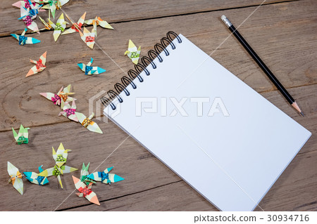 open note book with pencil on wood background open note book with pencil on wood background 30934716