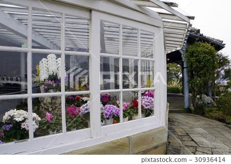 A greenhouse, also known as a conservatory, is a garden house, a good place to grow flowers. A greenhouse, also known as a conservatory, is a garden house, a good place to grow flowers. 30936414
