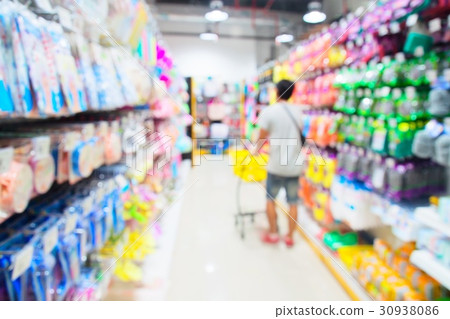 Blurred background supermarket with man shopping Blurred background supermarket with man shopping 30938086