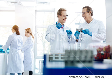Two men discussing their invention 30938365