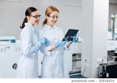 Two colleagues standing in semi position 30938428