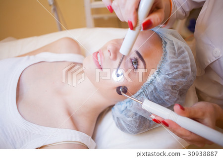 doctor cosmetologist doing facial massage girl Spa 30938887