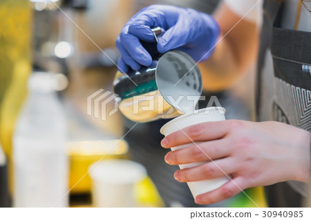 Close-up of Professional barista hands, preparing Close-up of Professional barista hands, preparing 30940985